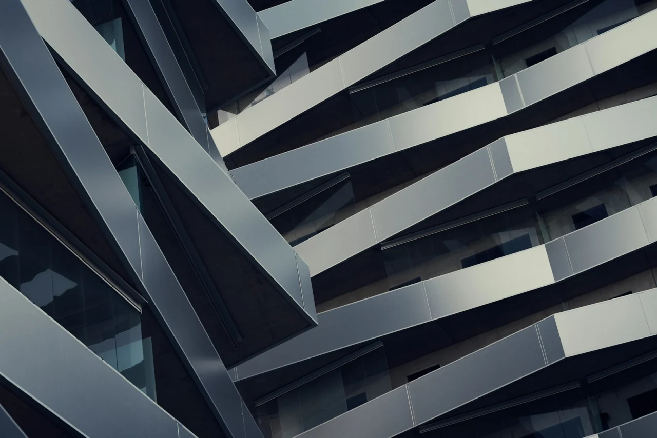 Low-angle view of a tall building against the sky, representing strong structural foundations