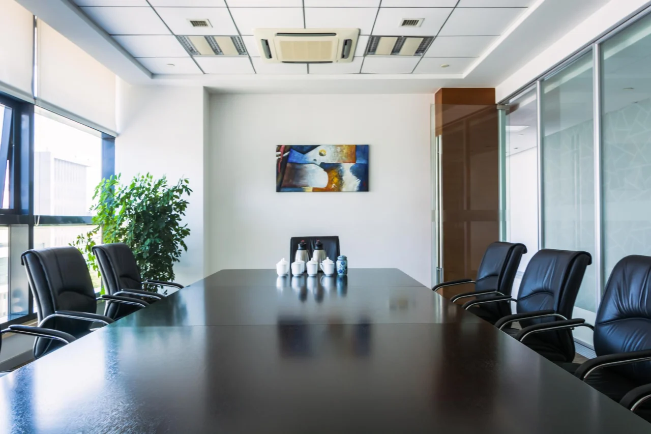 An empty boardroom seat a scaling company is deciding how to fill