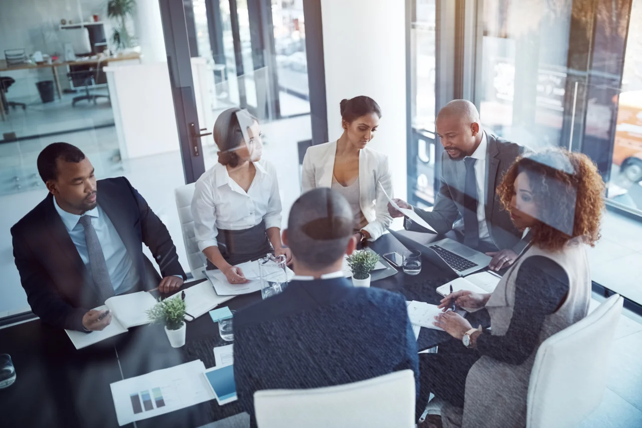 A management team reviewing monthly reporting