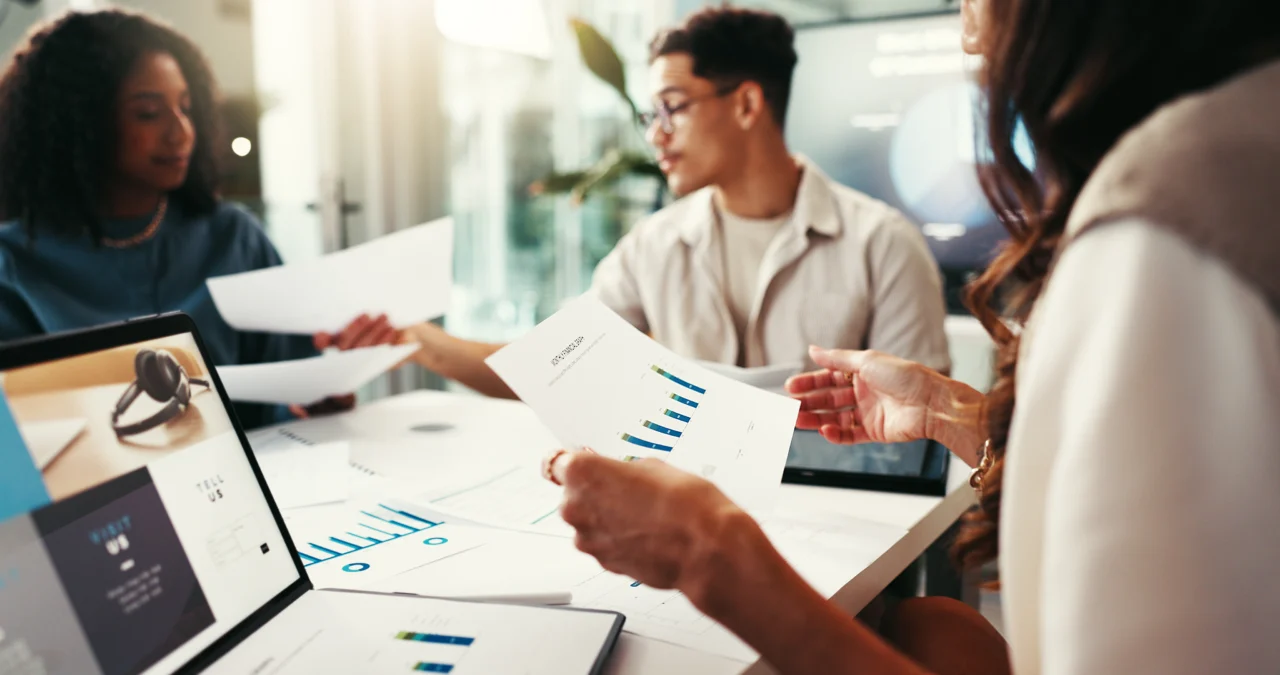 A finance lead and a founder reviewing a monthly reporting pack