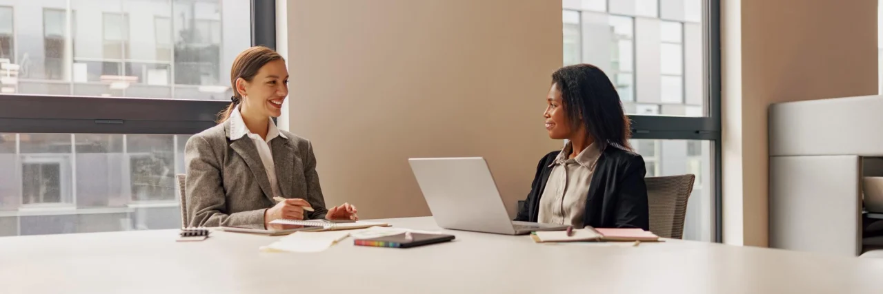 Two senior operators in discussion at a scaling company