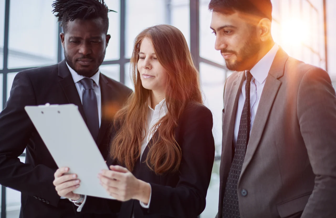 A founder and their leadership team reviewing monthly figures together